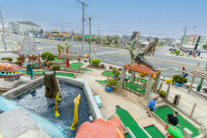 a miniature golf course on the side of a road
