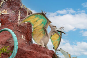 a statue of a dragon on a rock