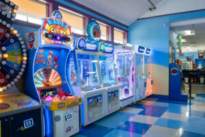 a brightly lit room with arcade machines in it
