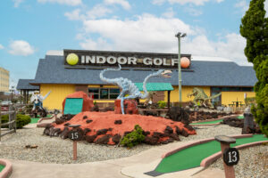 a miniature golf course in front of a store