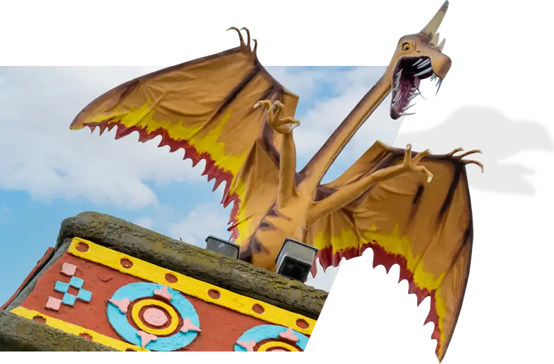 a dragon statue on top of a building