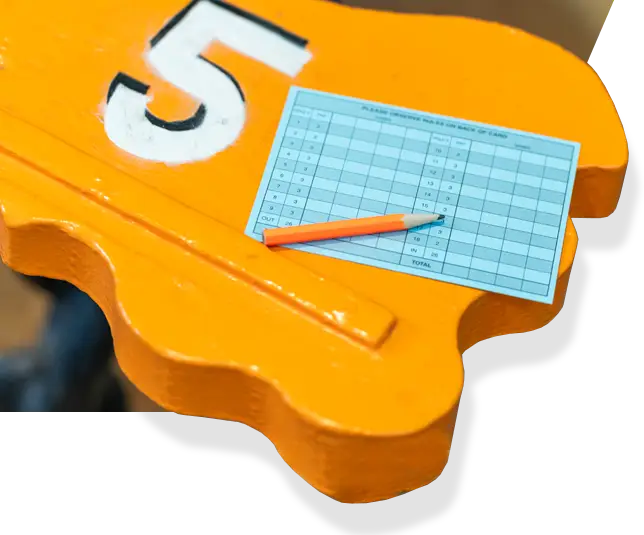 a yellow bench with a pencil on top of it