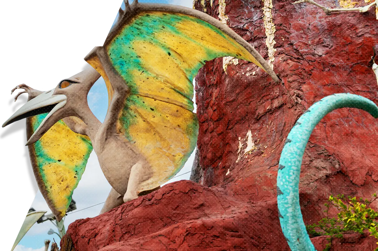 a statue of a dragon on a rock