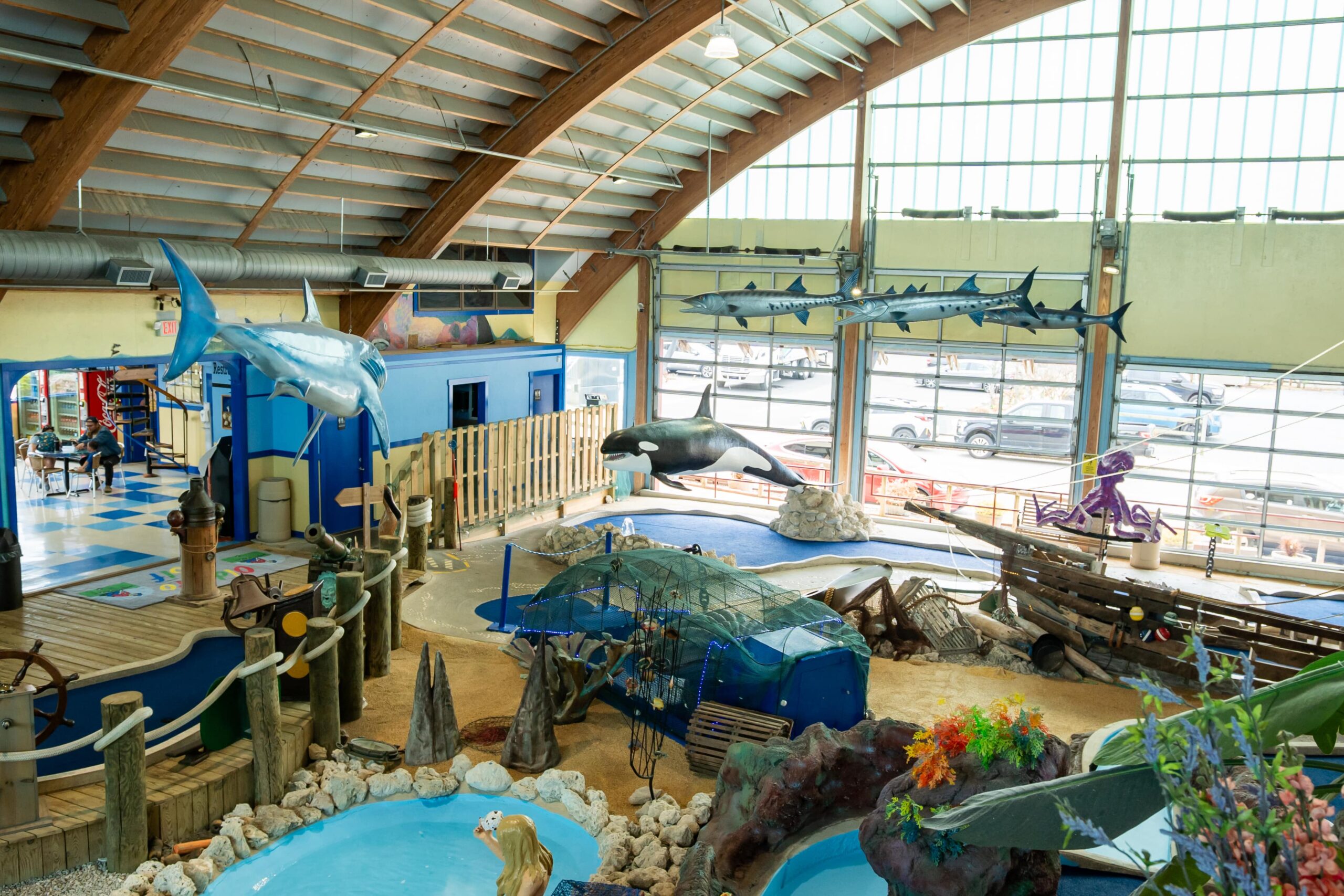 a large indoor water park with a water slide