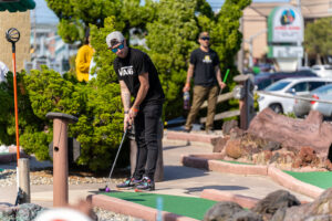 a man on a miniature golf course