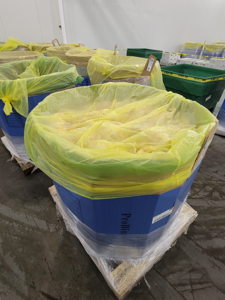 Large colorful bins filled with protein