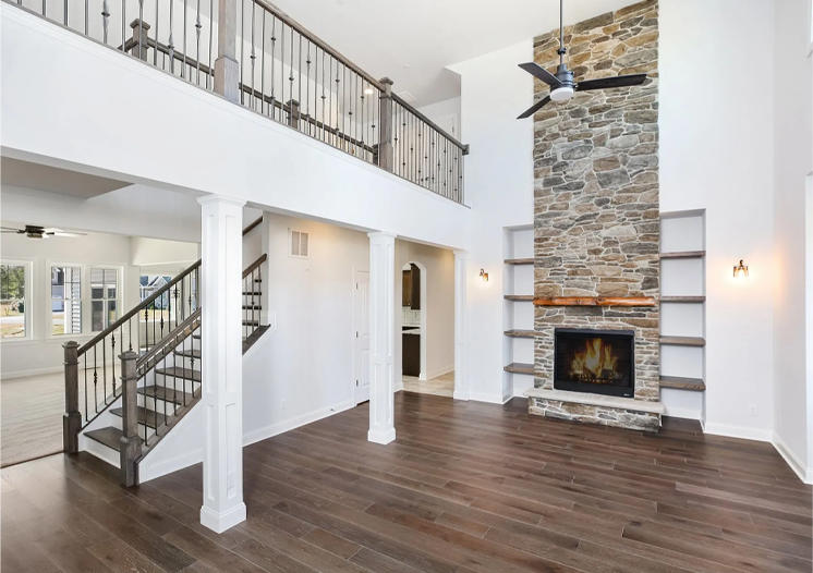 a large open floor plan with a fireplace