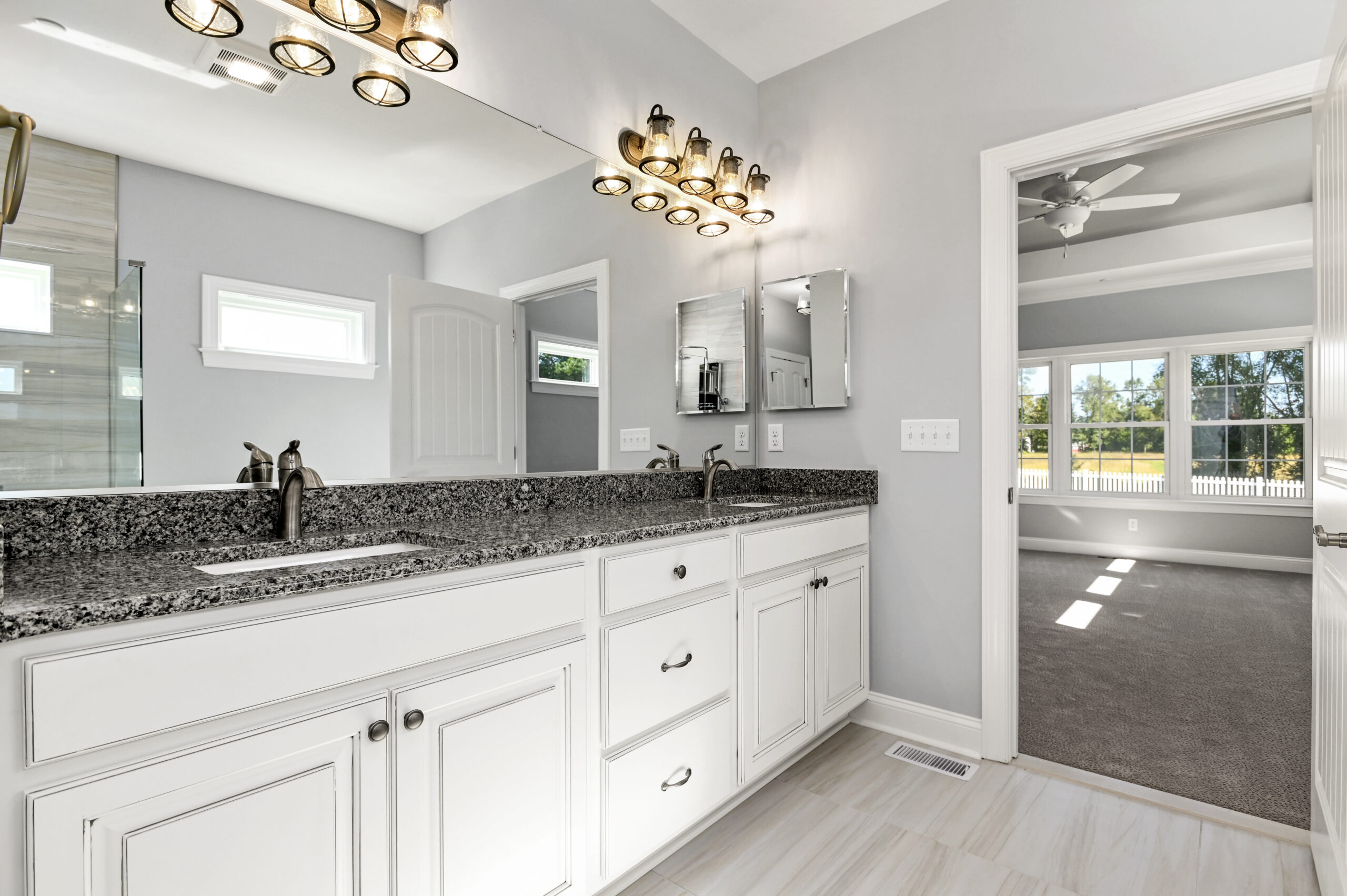 a bathroom with a double sink and a large mirror