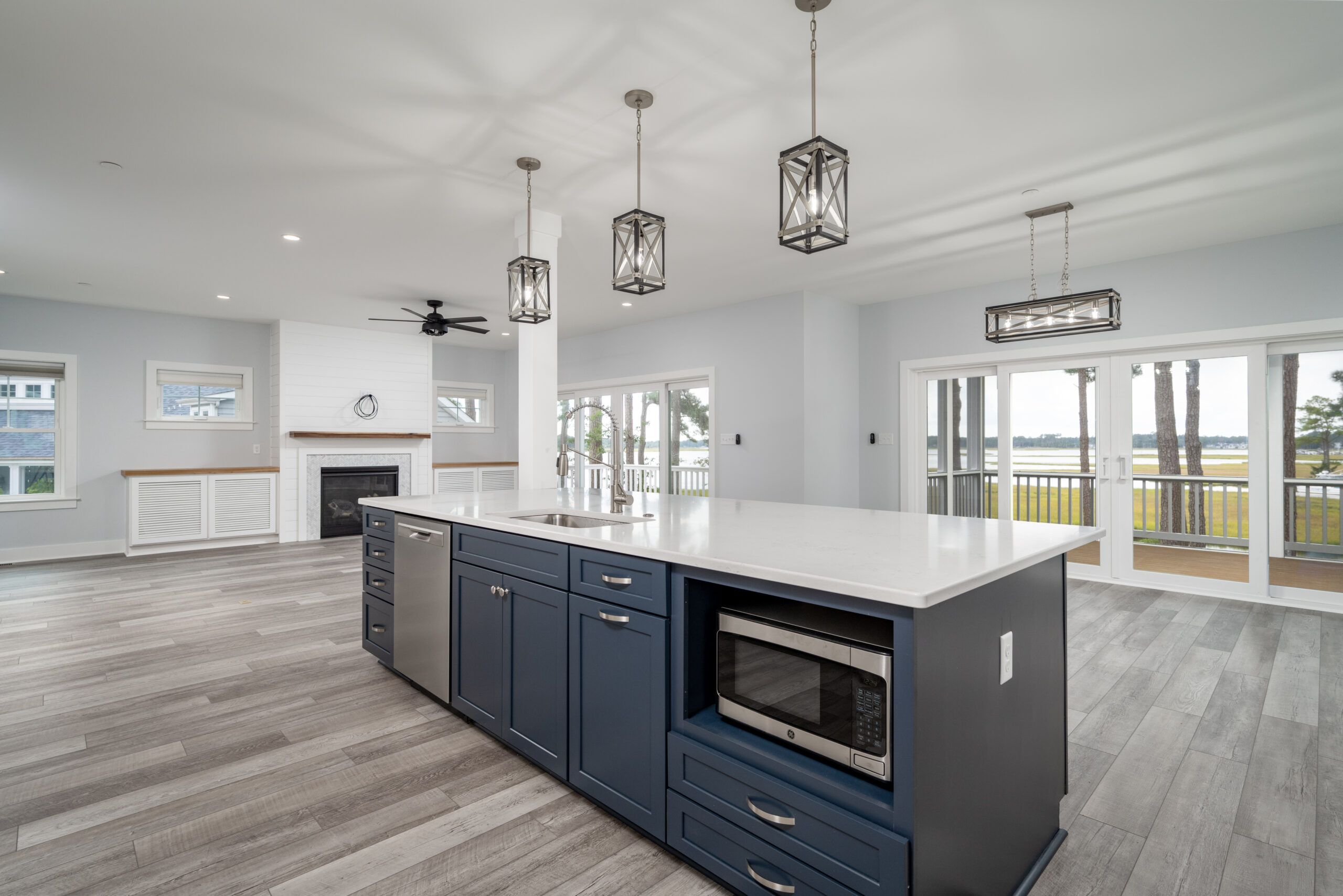 a large kitchen with an island in the middle of it