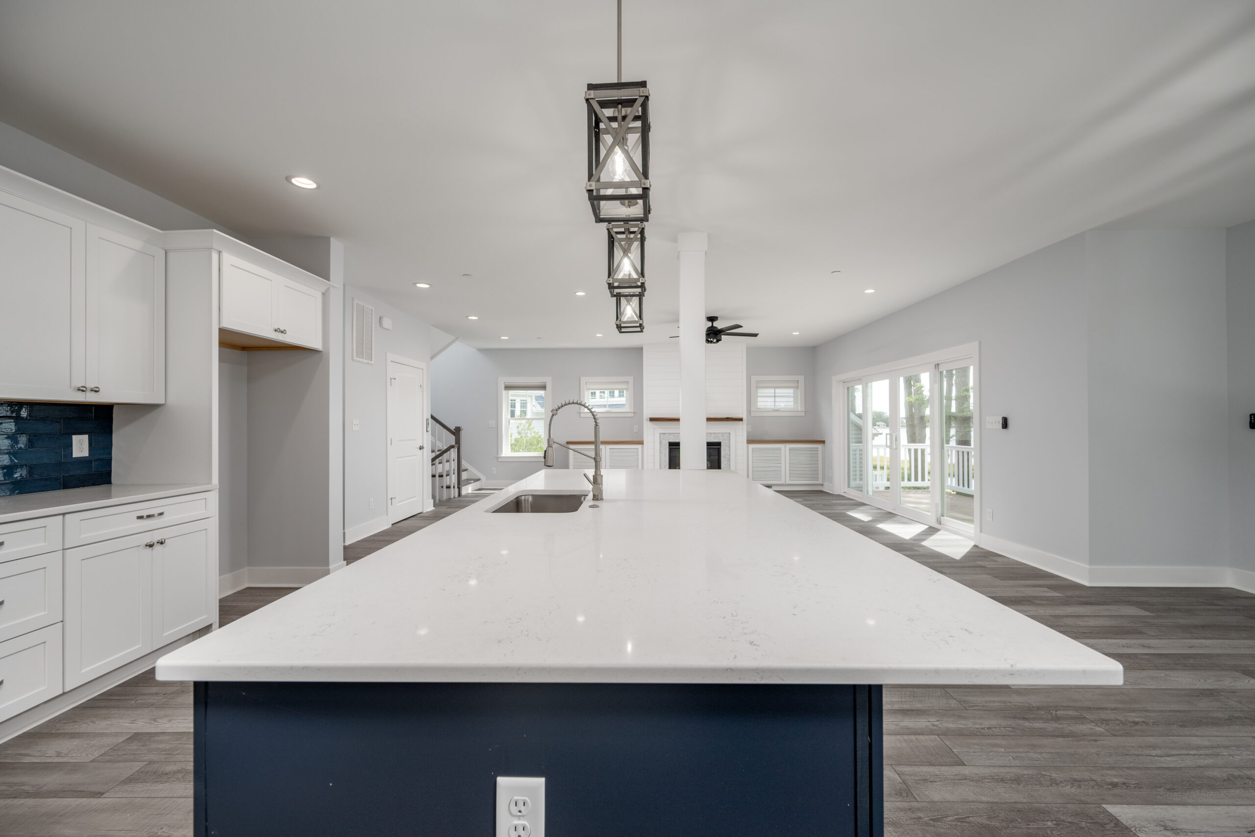 a large kitchen with an island in the middle of it