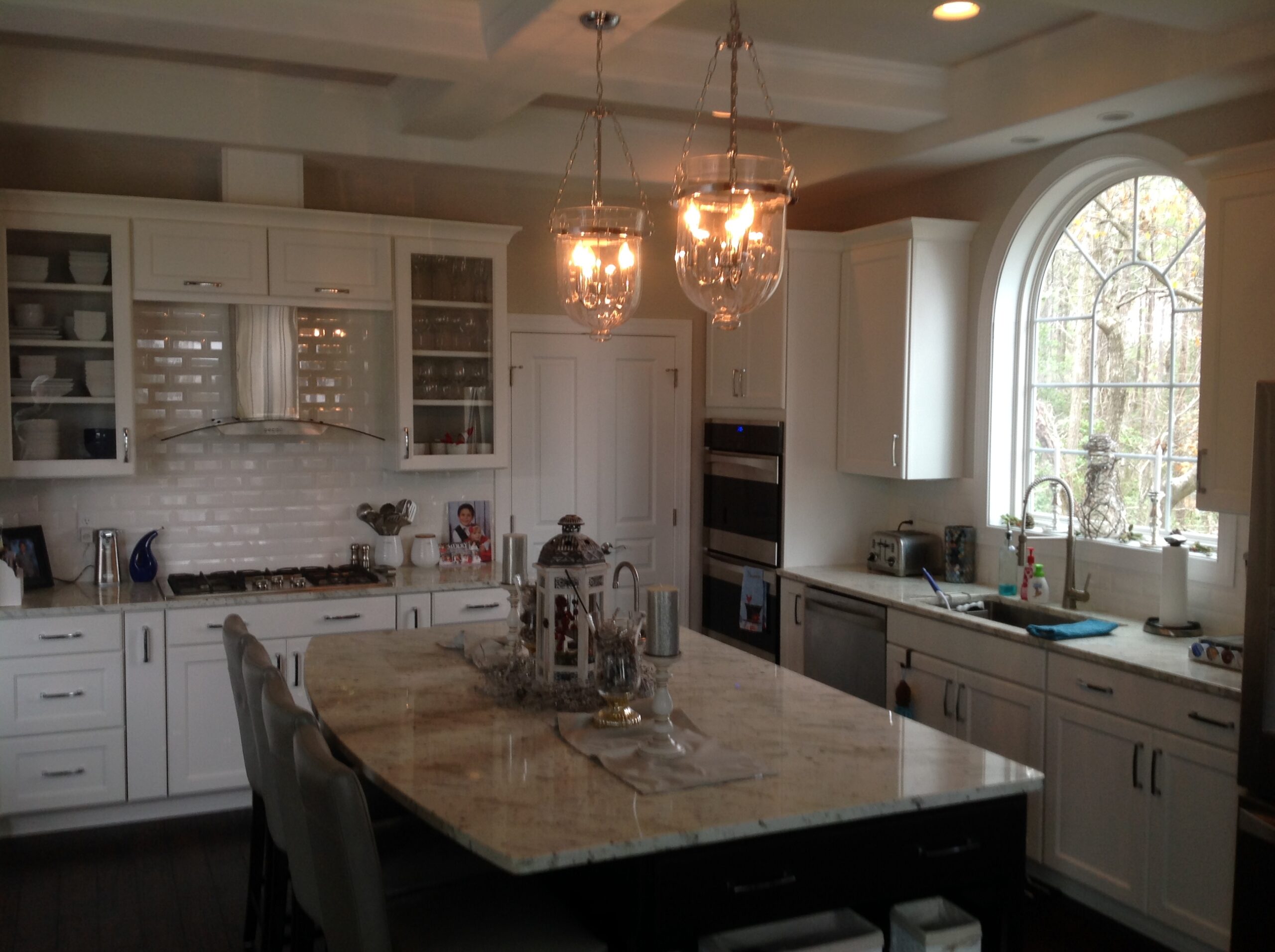 a large kitchen with a center island and a sink