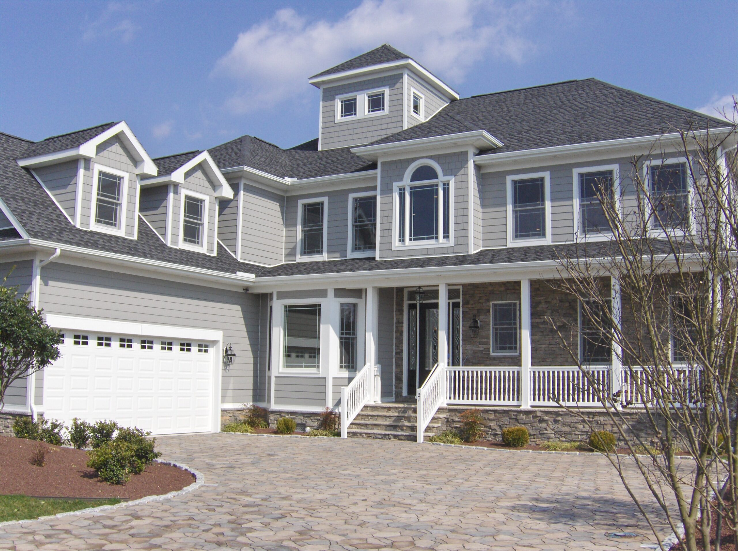 a large house with a driveway in front of it