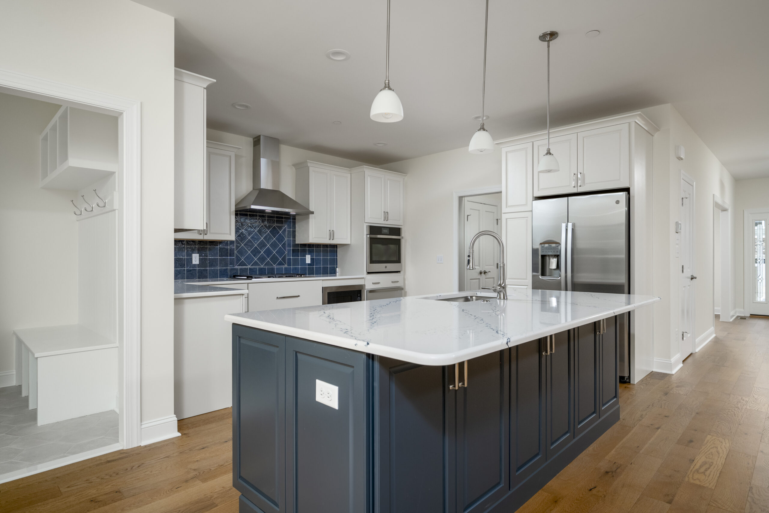 a large kitchen with an island in the middle of the room