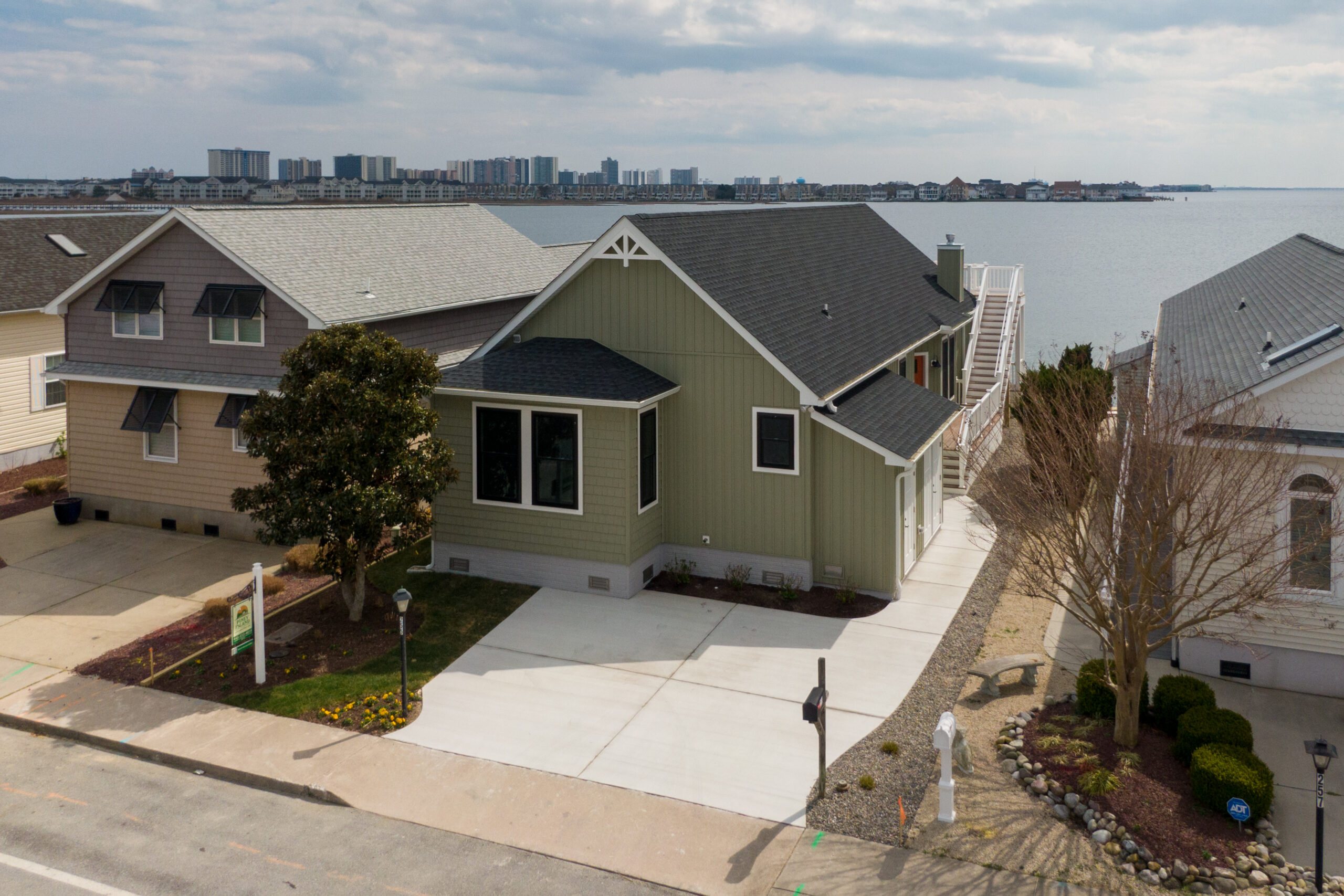a row of houses next to a body of water