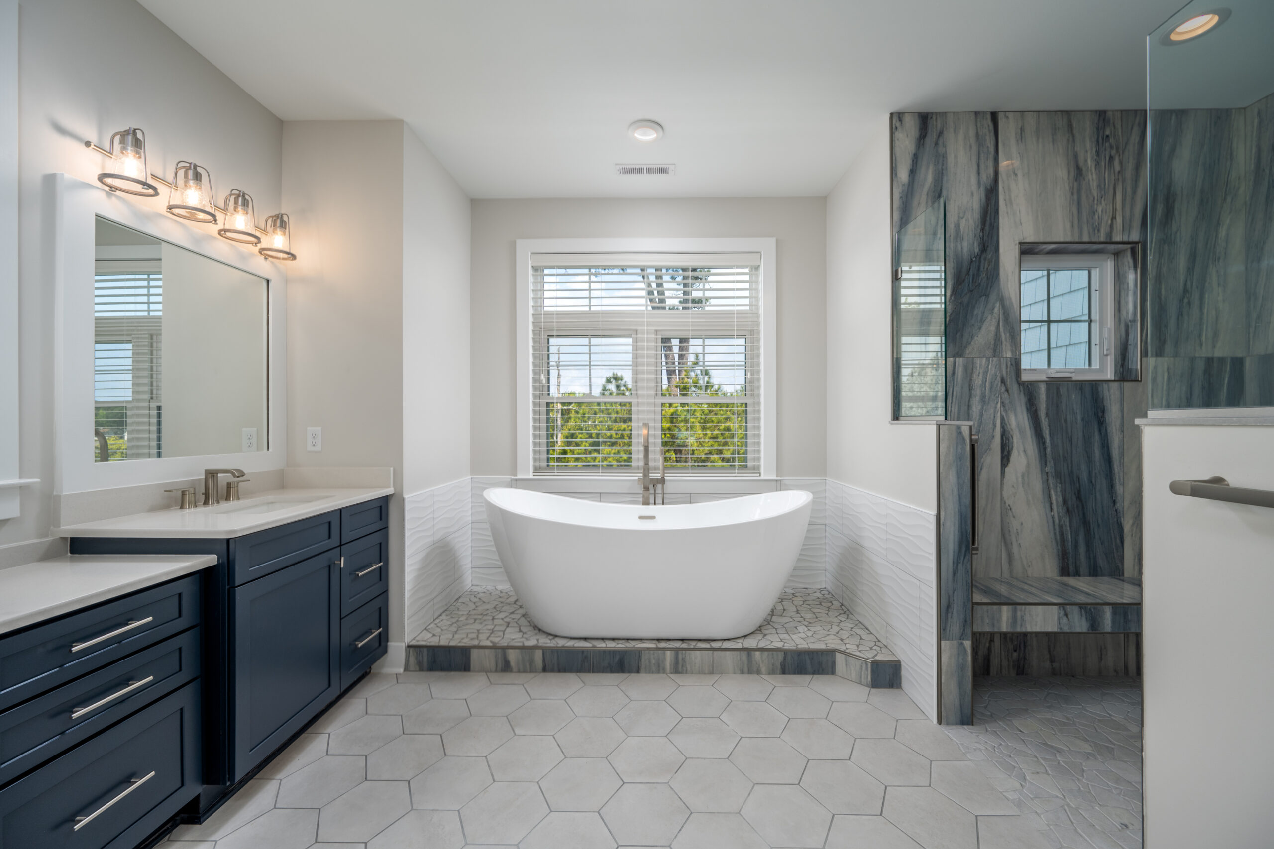 a large bathroom with a free standing tub