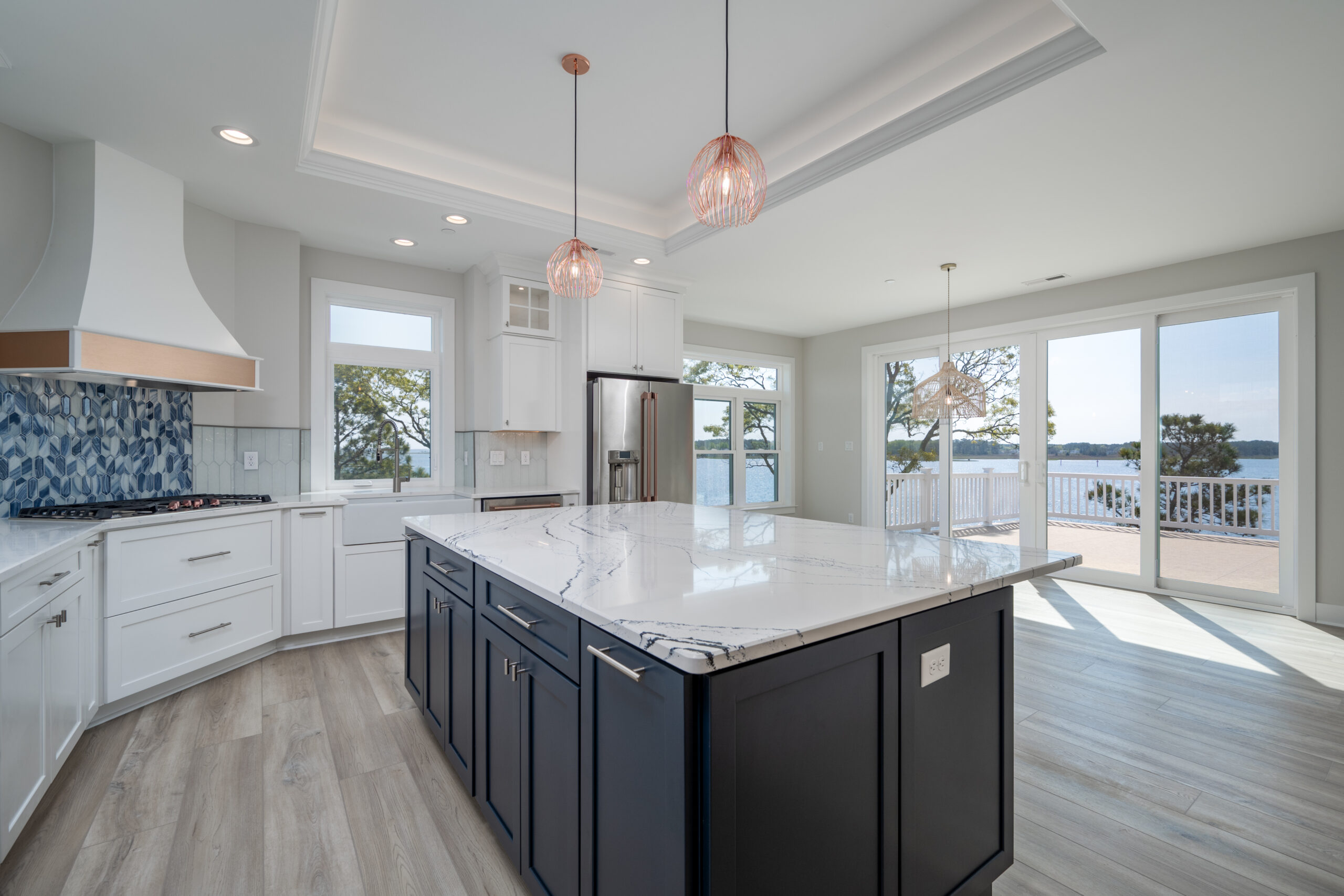 a large kitchen with an island in the middle of it