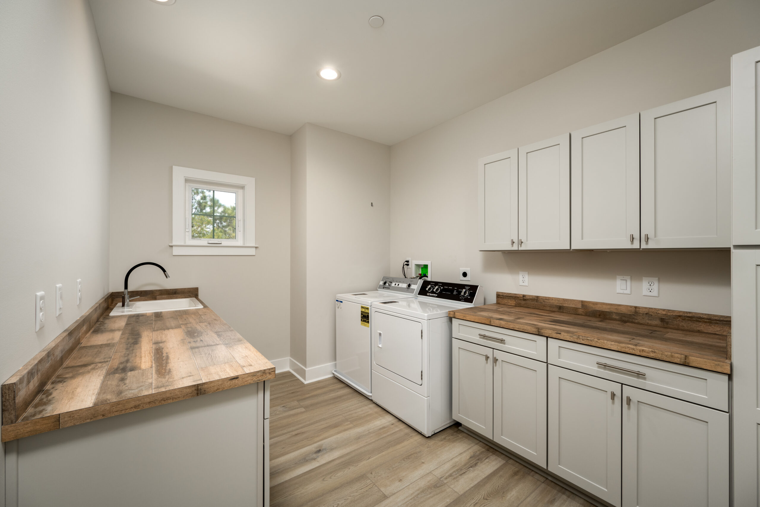 a kitchen with a washer and dryer in it