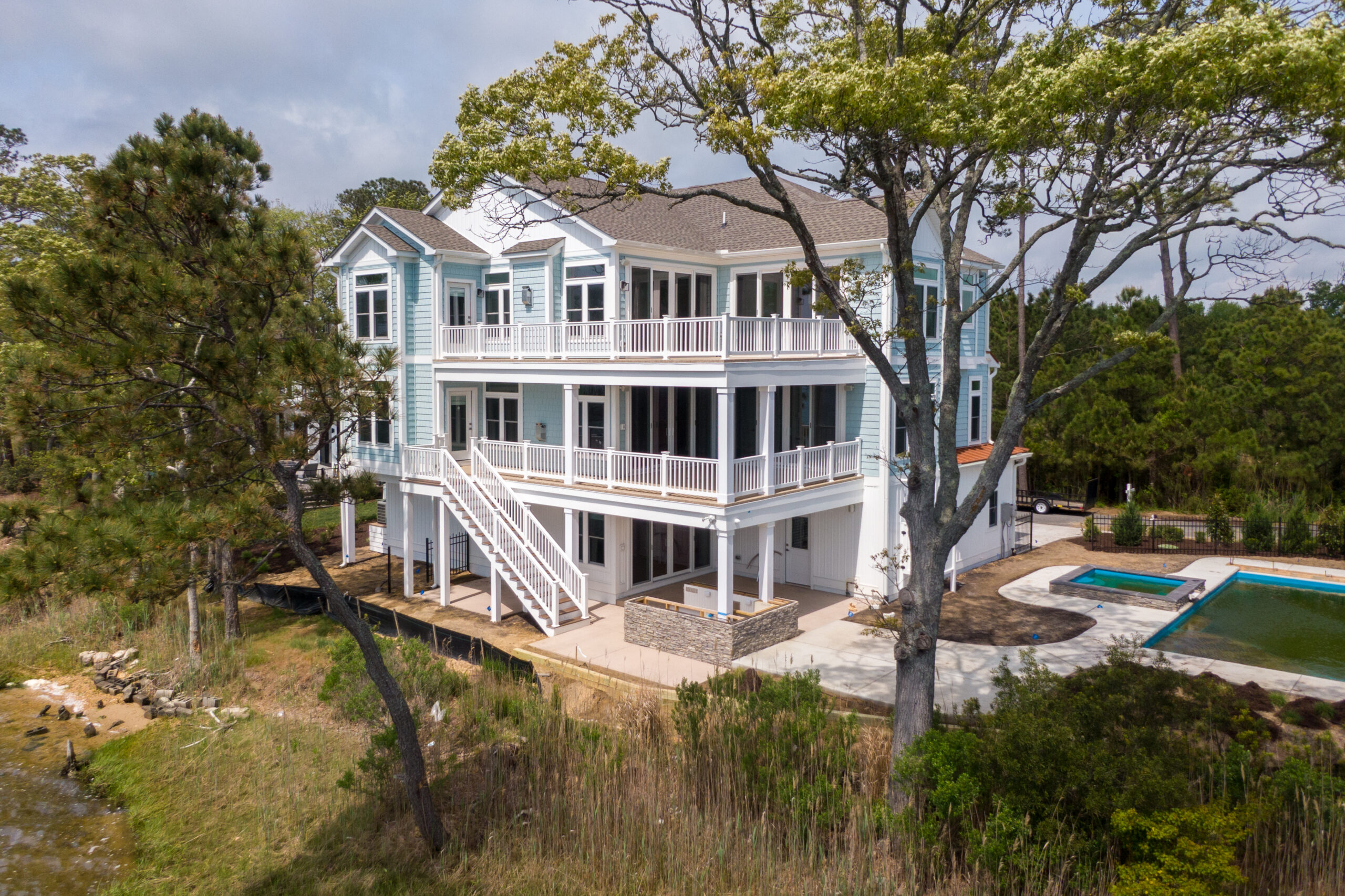 an aerial view of a house with a swimming pool