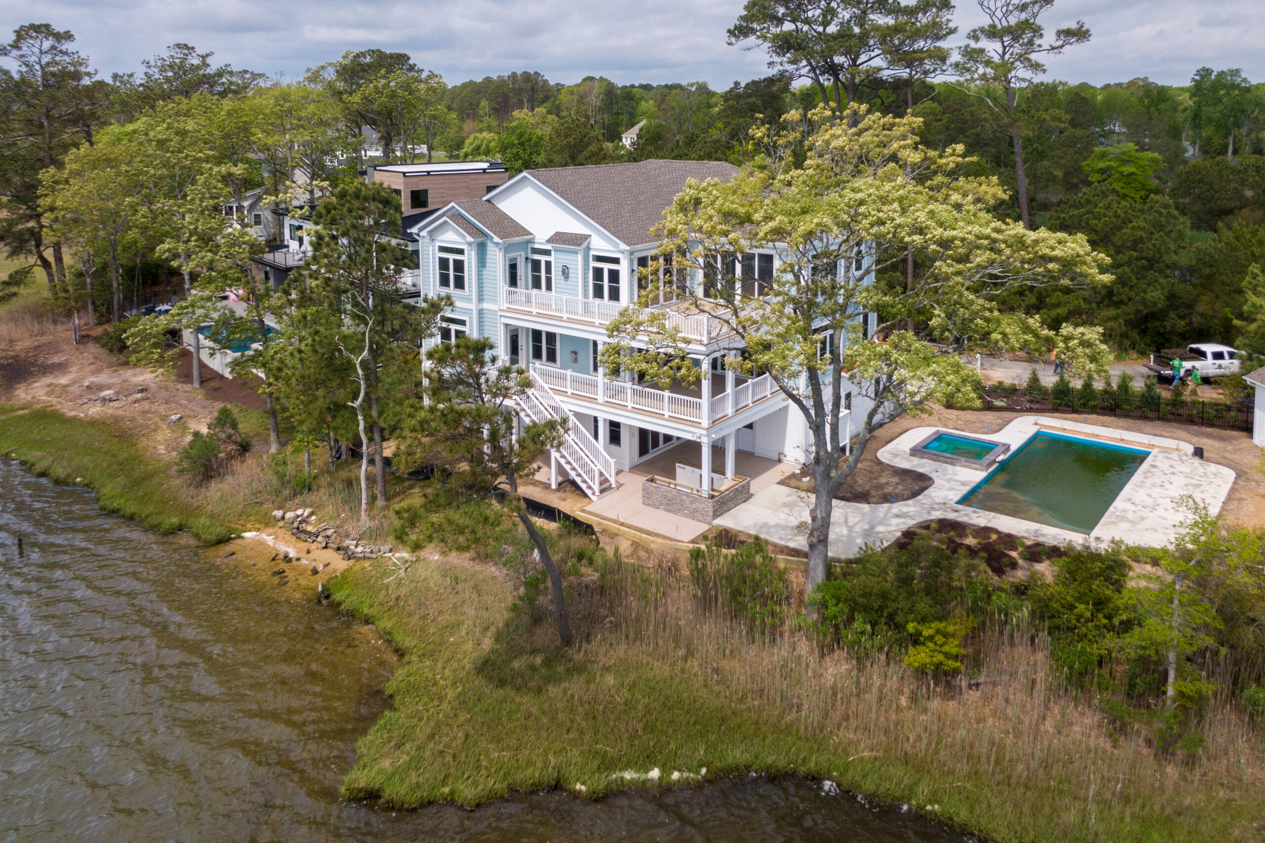 an aerial view of a large house with a swimming pool