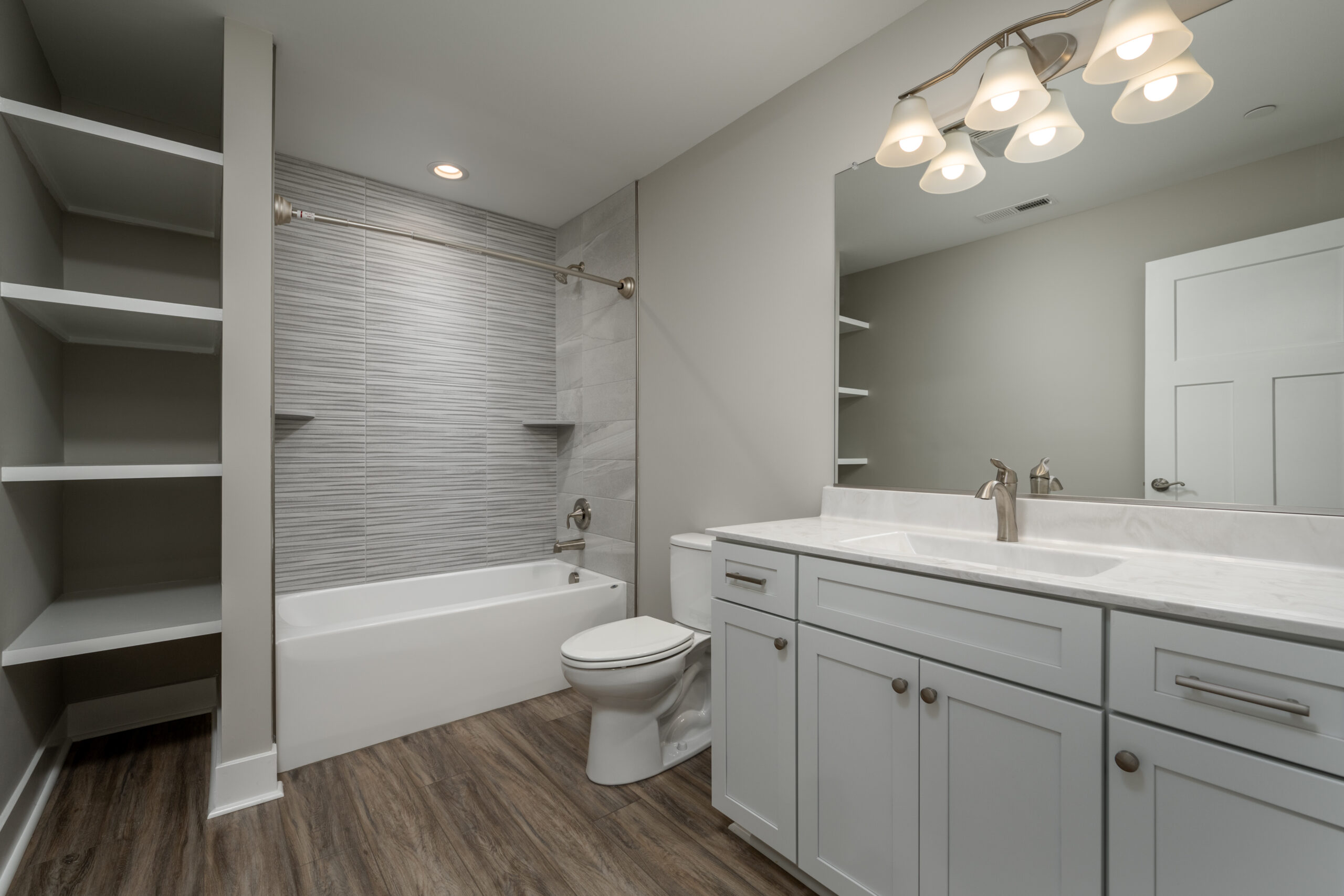 a bathroom with a toilet, sink, and bathtub