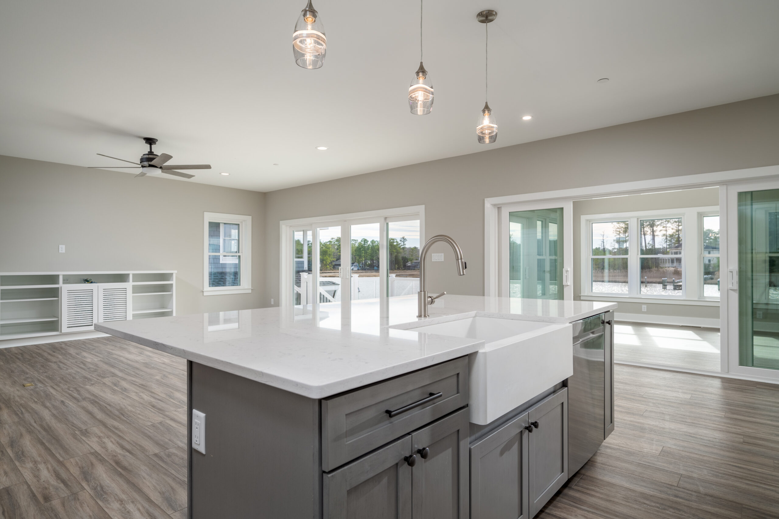 a large kitchen with a center island in the middle of the room