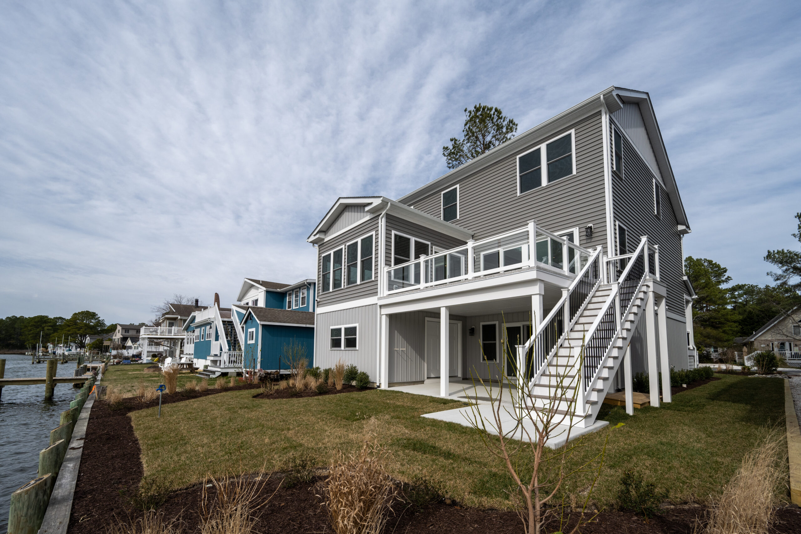 a house on the edge of a body of water