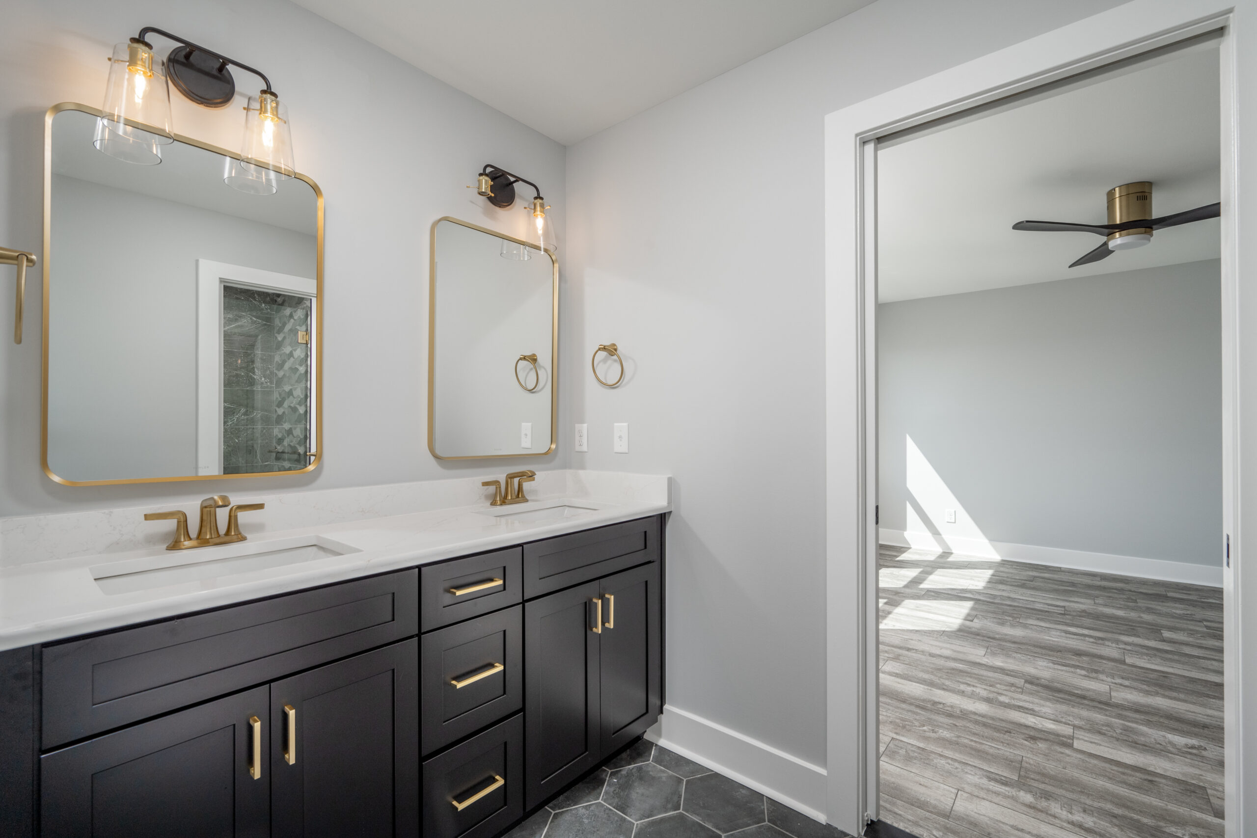 a bathroom with two sinks and a large mirror