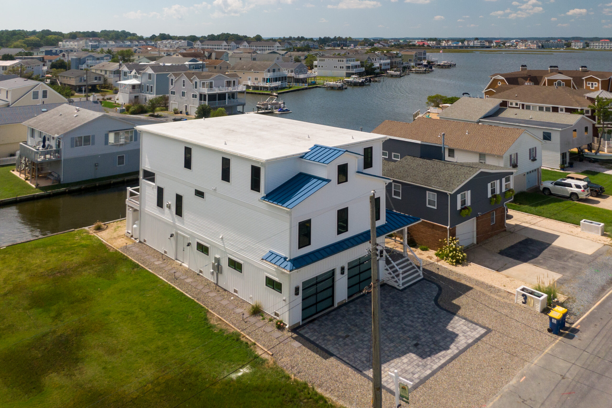 an aerial view of a neighborhood near a body of water