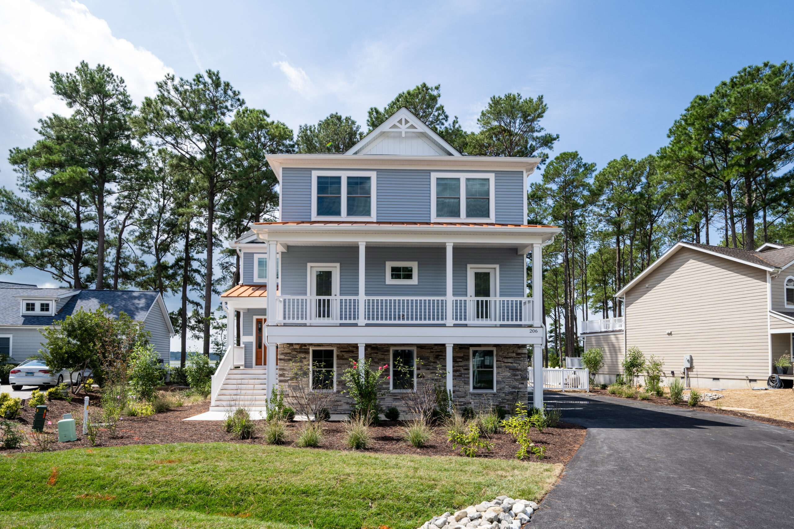a large house with a lot of trees in front of it