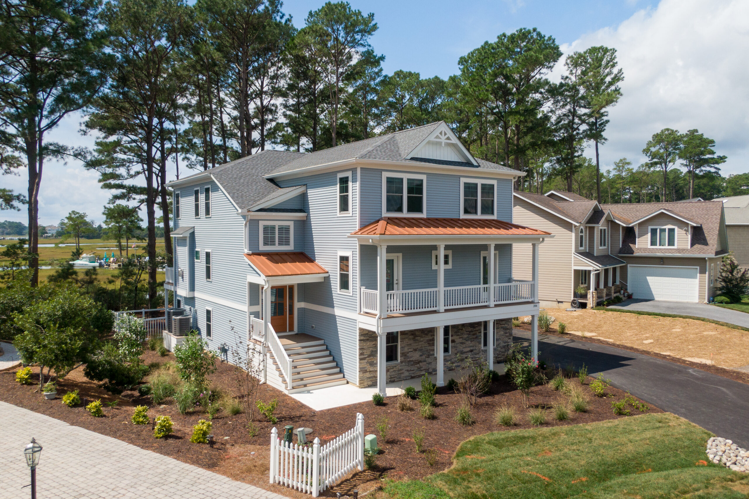 a large house with a lot of trees in front of it