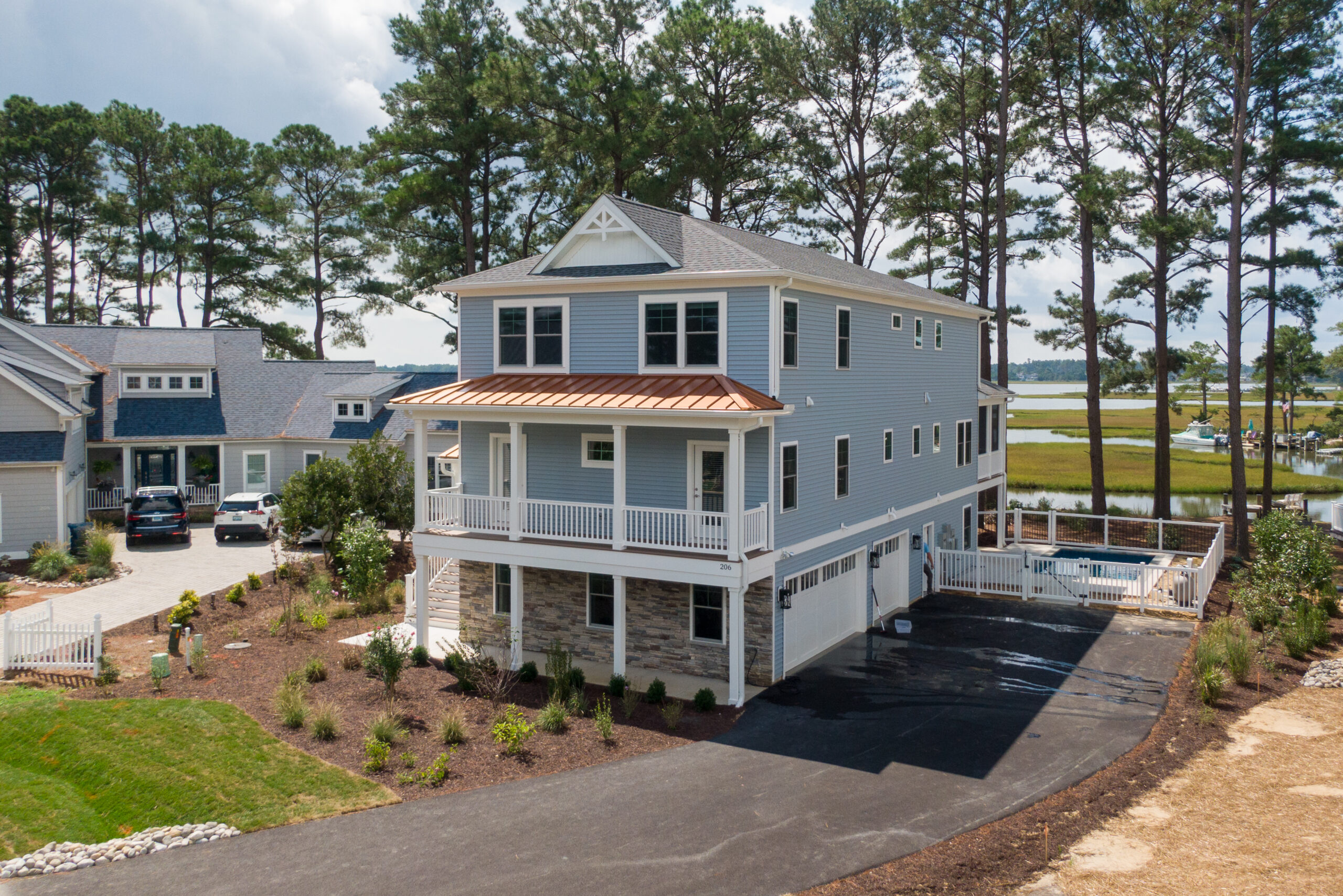 an aerial view of a home in the woods