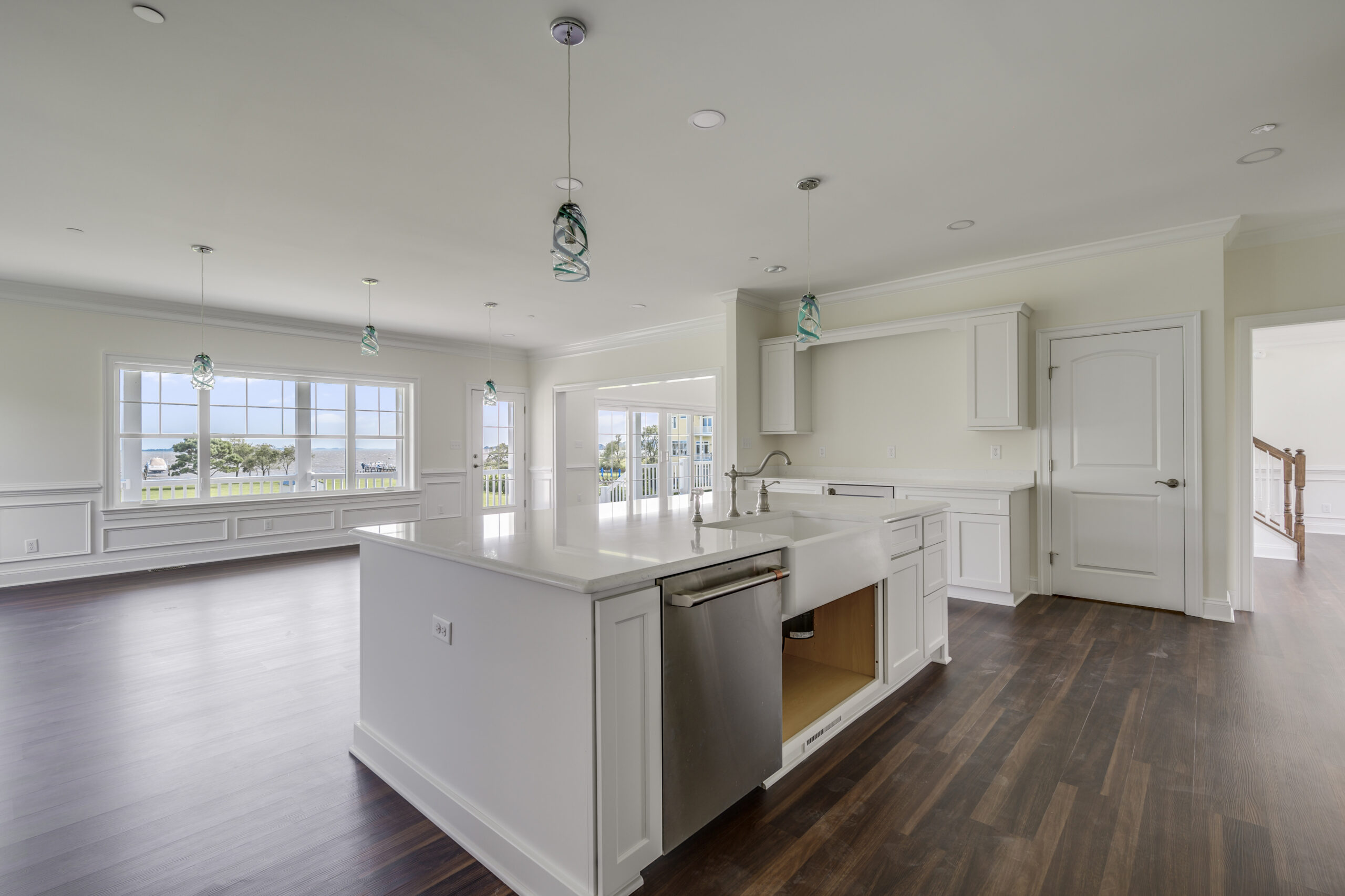 a large kitchen with an island in the middle of the room