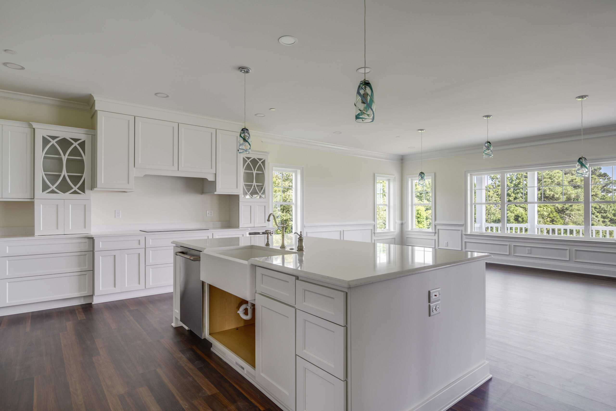 a large kitchen with a center island in the middle of the room