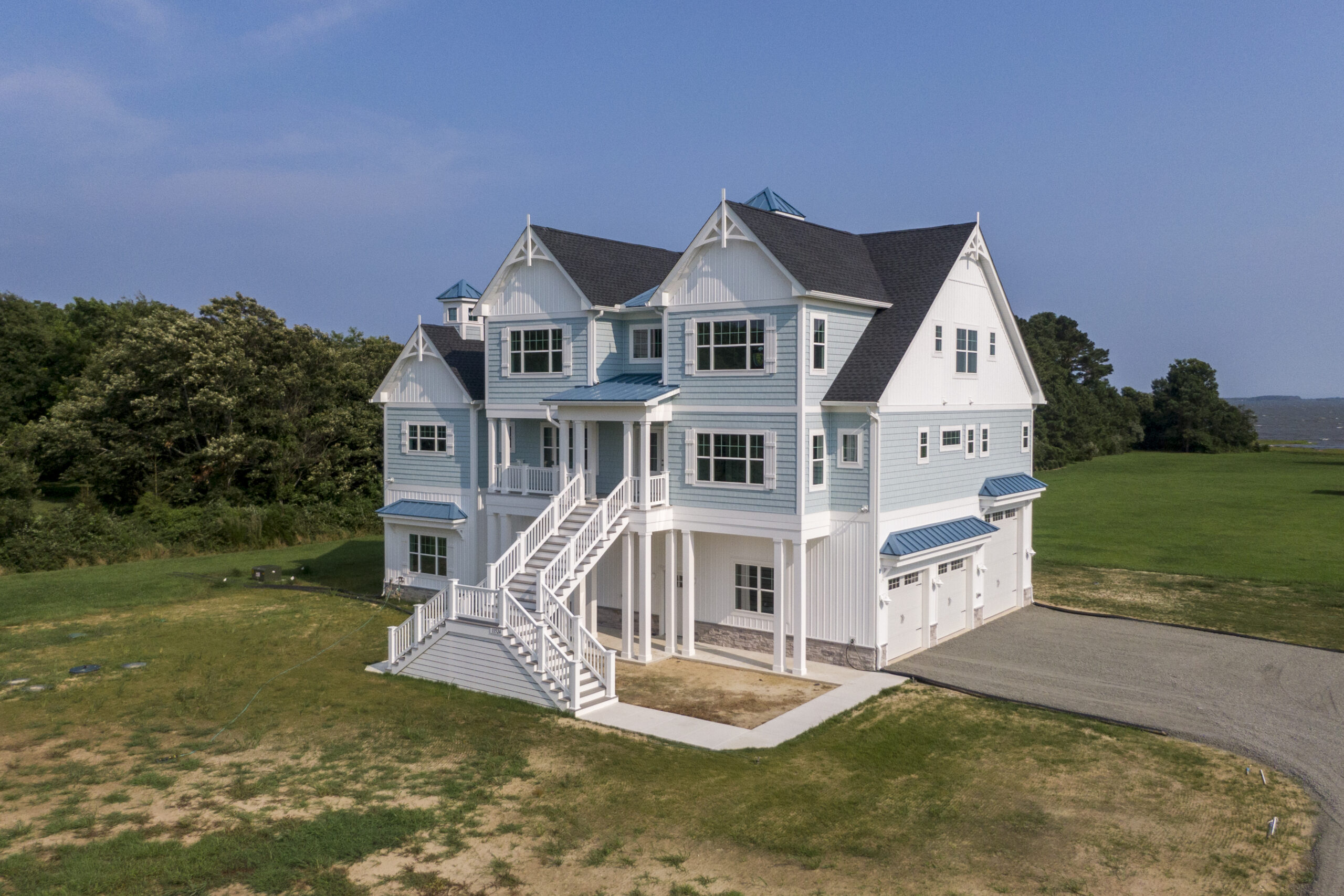 an aerial view of a large white house