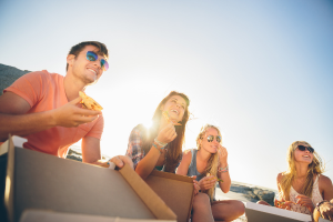 a group of people sitting on top of a boat