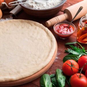 a wooden table topped with lots of different types of food