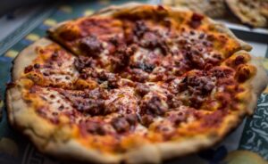 a close up of a pizza on a table