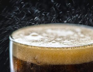 a close up of a beer in a glass