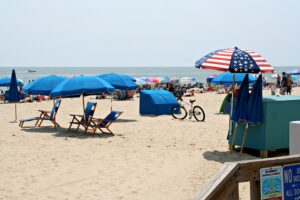 a beach with a bunch of umbrellas and chairs