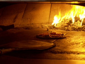 a pizza is cooking in a brick oven