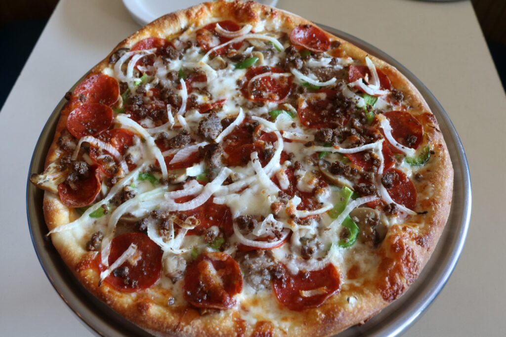 Primo Family Restaurant primo special pizza with pepperoni, onions, green peppers, mushrooms, ground beef, and sausage