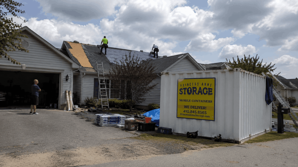 Mobile Storage Units Willards at an Eastern Shore roofing job with shingles and tools stored on-site