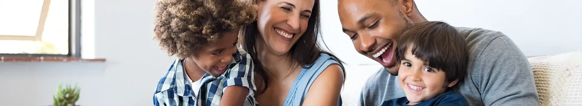 family of four smiling