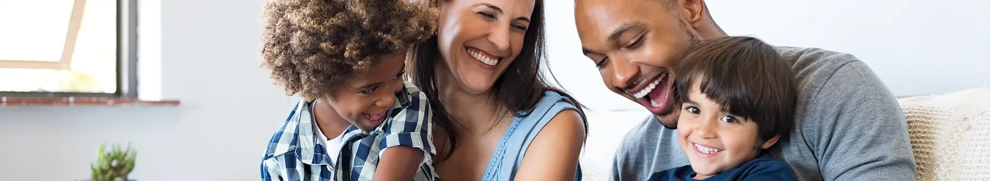 family of four smiling