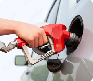 hand filling up gas tank for car