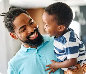father holding his son