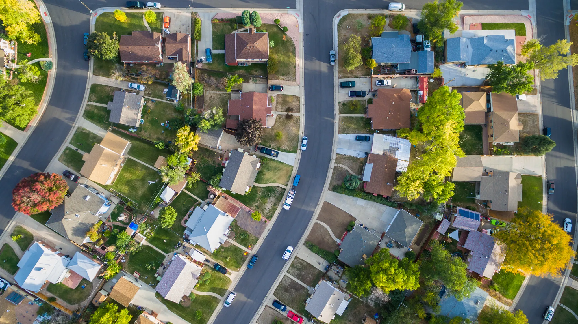 neighborhood with houses and cars