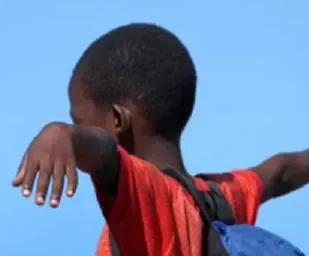boy with his hands up