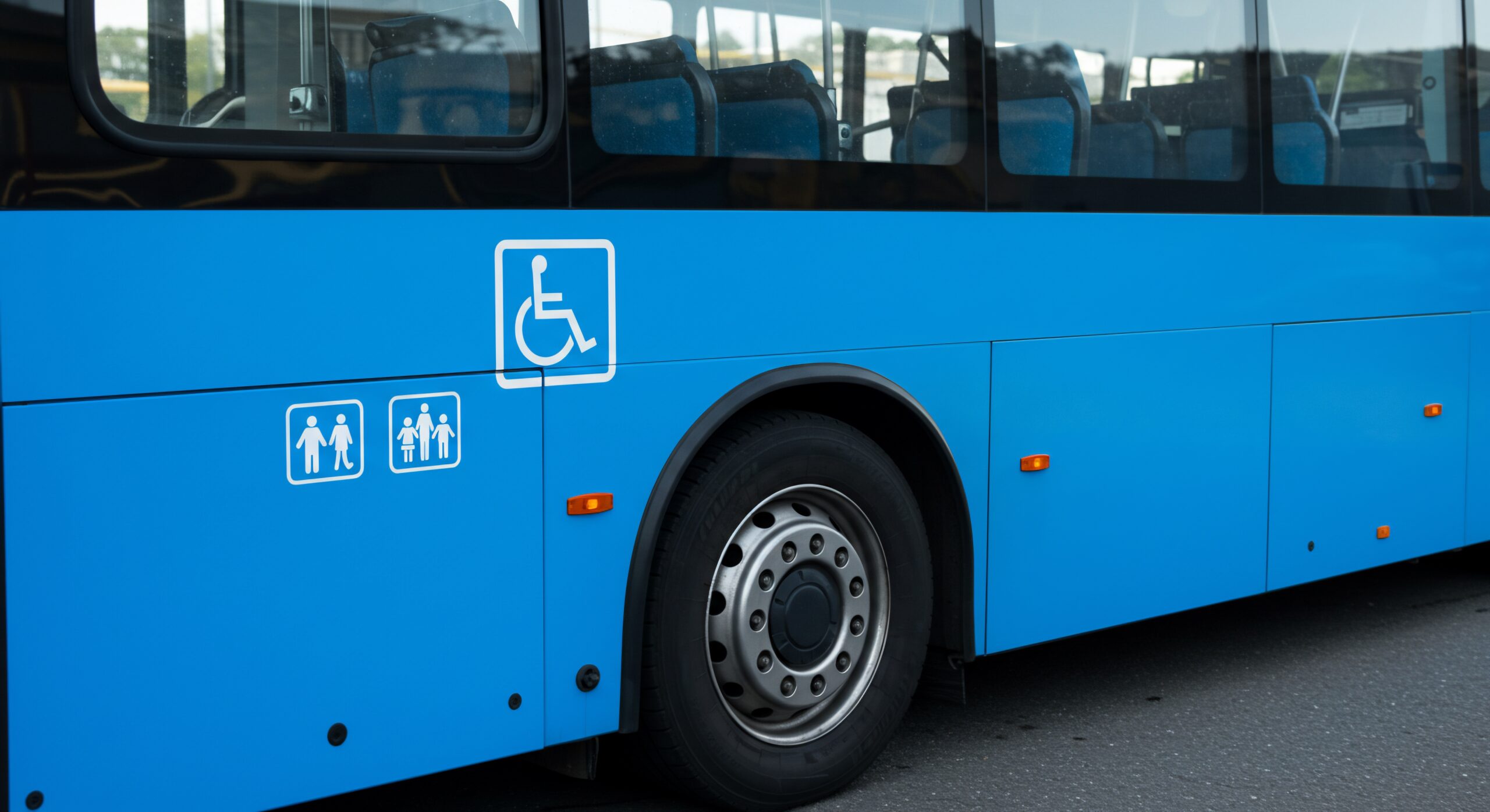 Bright Blue Bus Side with Accessibility and Family Pictograms