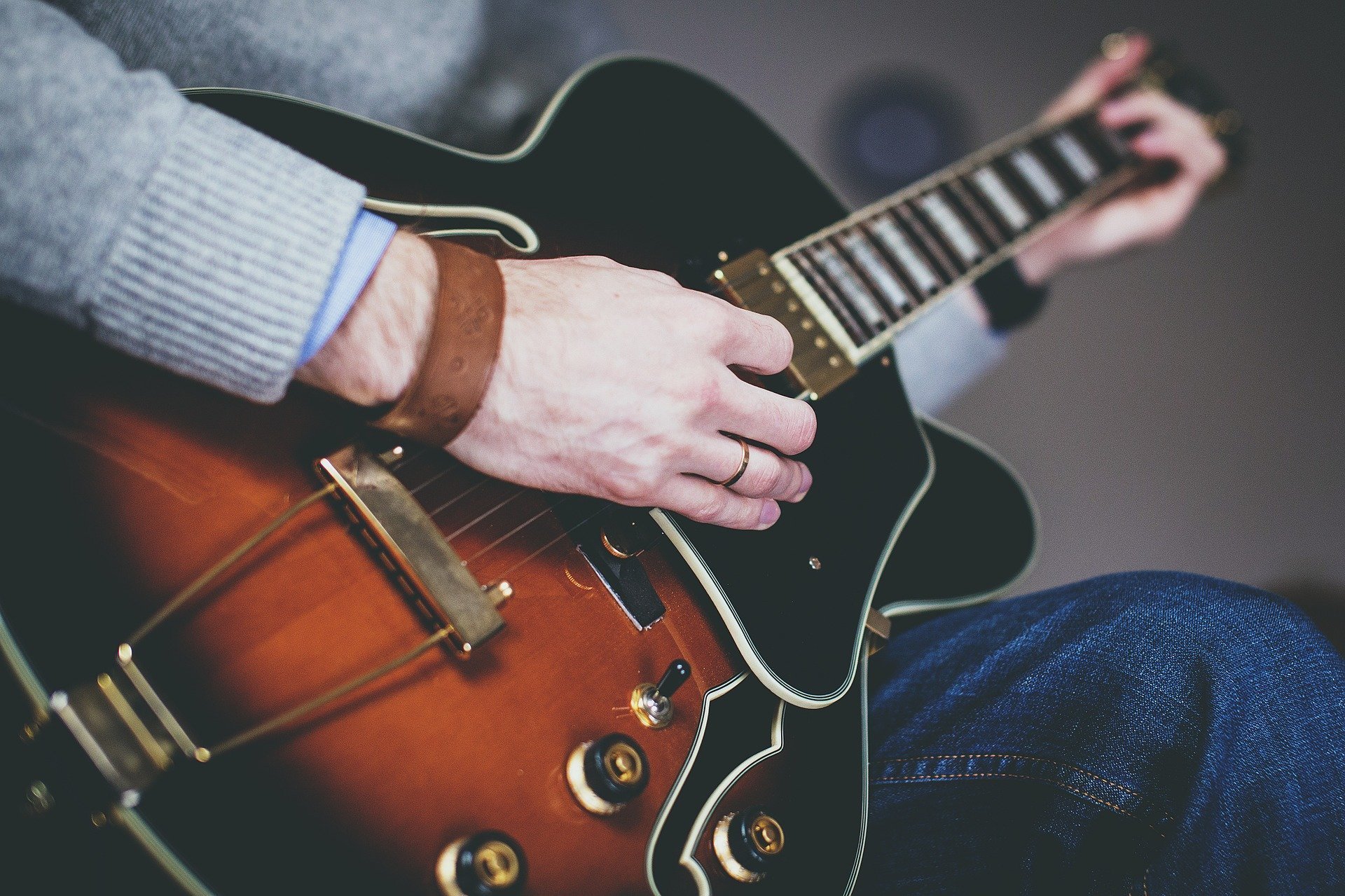 Sitting Guitar playing artist